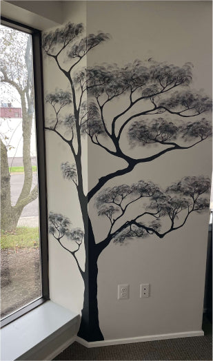 Hand-painted wall mural with  Japanese tree for the office painted by Karina Smyrnova at Feel Flow Space